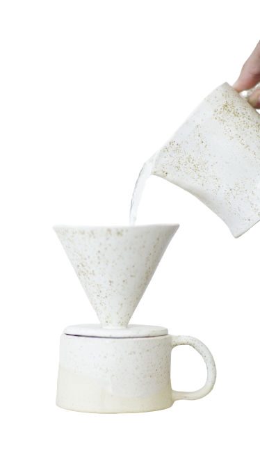 white ceramic coffee filter and mug